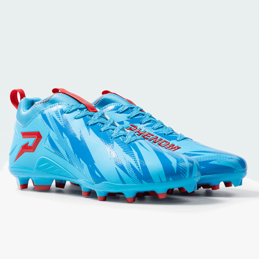 Blue soccer cleats with red accents on a light gray background